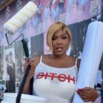 Lizzo hanging album posters