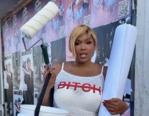Lizzo hanging album posters