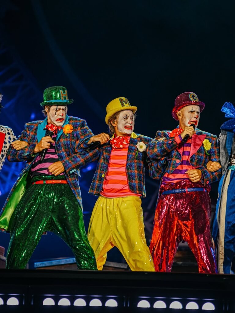 Take That dressed as clowns